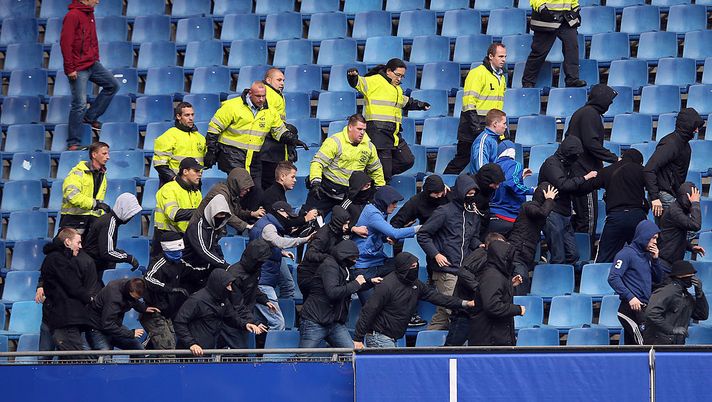 HAMBURG, GERMANY - SEPTEMBER 21: Security consents hooligans of Hamburg who wants to attack hooligans of Bremen prior to the Bundesliga match between Hamburger SV and Werder Bremen at Imtech Arena on September 21, 2013 in Hamburg, Germany. (Photo by Christof Koepsel/Bongarts/Getty Images) HAMBURG, GERMANY - SEPTEMBER 21: Security consents hooligans of Hamburg who wants to attack hooligans of Bremen prior to the Bundesliga match between Hamburger SV and Werder Bremen at Imtech Arena on September 21, 2013 in Hamburg, Germany. (Photo by Christof Koepsel/Bongarts/Getty Images)