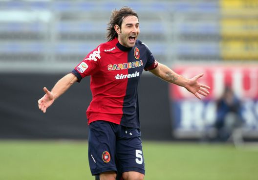CAGLIARI, ITALY - FEBRUARY 24:Daniele Conti of Cagliari celebrates with the son after scoring 2-2 during the Serie A match between Cagliari Calcio and Torino FC at Stadio Sant'Elia on February 24, 2013 in Cagliari, Italy. (Photo by Enrico Locci/Getty Images) CAGLIARI, ITALY - FEBRUARY 24:Daniele Conti of Cagliari celebrates with the son after scoring 2-2 during the Serie A match between Cagliari Calcio and Torino FC at Stadio Sant'Elia on February 24, 2013 in Cagliari, Italy. (Photo by Enrico Locci/Getty Images)