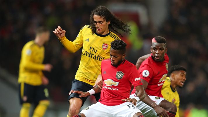 MANCHESTER, ENGLAND - SEPTEMBER 30: Matteo Guendouzi of Arsenal battles for possession with Fred of Manchester United and Paul Pogba of Manchester United during the Premier League match between Manchester United and Arsenal FC at Old Trafford on September 30, 2019 in Manchester, United Kingdom. (Photo by Catherine Ivill/Getty Images) MANCHESTER, ENGLAND - SEPTEMBER 30: Matteo Guendouzi of Arsenal battles for possession with Fred of Manchester United and Paul Pogba of Manchester United during the Premier League match between Manchester United and Arsenal FC at Old Trafford on September 30, 2019 in Manchester, United Kingdom. (Photo by Catherine Ivill/Getty Images)