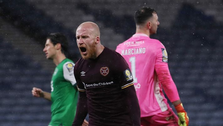 GLASGOW, SCOTLAND - OCTOBER 31: Liam Boyce of Heart of Midlothian celebrates after scoring his team's second goal from the penalty spot during the William Hill Scottish Cup first semi-final match between Heart of Midlothian and Hibernian at Hampden Park National Stadium on October 31, 2020 in Glasgow, Scotland. Sporting stadiums around the UK remain under strict restrictions due to the Coronavirus Pandemic as Government social distancing laws prohibit fans inside venues resulting in games being played behind closed doors. (Photo by Ian MacNicol/Getty Images) GLASGOW, SCOTLAND - OCTOBER 31: Liam Boyce of Heart of Midlothian celebrates after scoring his team's second goal from the penalty spot during the William Hill Scottish Cup first semi-final match between Heart of Midlothian and Hibernian at Hampden Park National Stadium on October 31, 2020 in Glasgow, Scotland. Sporting stadiums around the UK remain under strict restrictions due to the Coronavirus Pandemic as Government social distancing laws prohibit fans inside venues resulting in games being played behind closed doors. (Photo by Ian MacNicol/Getty Images)