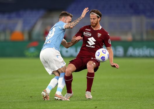 ROME, ITALY - MAY 18: Manuel Lazzari of S.S. Lazio battles for possession with Cristian Ansaldi of Torino FC during the Serie A match between SS Lazio and Torino FC at Stadio Olimpico on May 18, 2021 in Rome, Italy. Sporting stadiums around Italy remain under strict restrictions due to the Coronavirus Pandemic as Government social distancing laws prohibit fans inside venues resulting in games being played behind closed doors. (Photo by Paolo Bruno/Getty Images) ROME, ITALY - MAY 18: Manuel Lazzari of S.S. Lazio battles for possession with Cristian Ansaldi of Torino FC during the Serie A match between SS Lazio and Torino FC at Stadio Olimpico on May 18, 2021 in Rome, Italy. Sporting stadiums around Italy remain under strict restrictions due to the Coronavirus Pandemic as Government social distancing laws prohibit fans inside venues resulting in games being played behind closed doors. (Photo by Paolo Bruno/Getty Images)