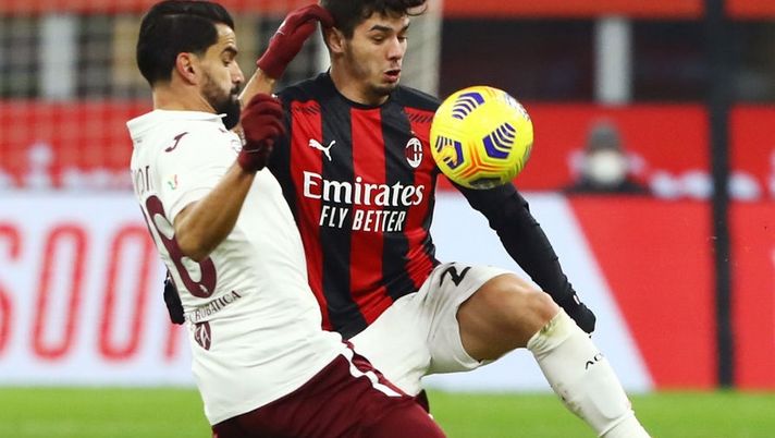 MILAN, ITALY - JANUARY 12: Brahim Diaz of A.C. Milan is challenged by Tomas Rincon of Torino F.C. during the Coppa Italia match between AC Milan and Torino FC at Stadio Giuseppe Meazza on January 12, 2021 in Milan, Italy. Sporting stadiums around Italy remain under strict restrictions due to the Coronavirus Pandemic as Government social distancing laws prohibit fans inside venues resulting in games being played behind closed doors. (Photo by Marco Luzzani/Getty Images) MILAN, ITALY - JANUARY 12: Brahim Diaz of A.C. Milan is challenged by Tomas Rincon of Torino F.C. during the Coppa Italia match between AC Milan and Torino FC at Stadio Giuseppe Meazza on January 12, 2021 in Milan, Italy. Sporting stadiums around Italy remain under strict restrictions due to the Coronavirus Pandemic as Government social distancing laws prohibit fans inside venues resulting in games being played behind closed doors. (Photo by Marco Luzzani/Getty Images)