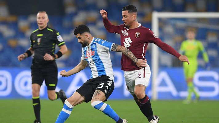 NAPLES, ITALY - DECEMBER 23: Elseid Hysaj of SSC Napoli is challenged by Armando Izzo of Torino during the Serie A match between SSC Napoli and Torino FC at Stadio Diego Armando Maradona on December 23, 2020 in Naples, Italy. Sporting stadiums around Italy remain under strict restrictions due to the Coronavirus Pandemic as Government social distancing laws prohibit fans inside venues resulting in games being played behind closed doors. (Photo by Francesco Pecoraro/Getty Images) 