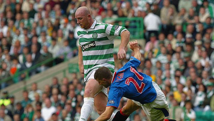 GLASGOW, SCOTLAND - AUGUST 29:  Gregory Vignal of Rangers challenges John Hartson of Celtic during the Scottish Premiership match between Celtic and Rangers at Celtic Park on August 29, 2004 in Glasgow, Scotland. (Photo by Bruno Vincent/Getty Images) 