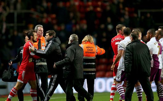 SOUTHAMPTON, ENGLAND - DECEMBER 04: Mauricio Pochettino manager of Southampton holds back Pablo Daniel Osvaldo of Southampton after the Barclays Premier League match between Southampton and Aston Villa at St Mary's Stadium on December 4, 2013 in Southampton, England. (Photo by Bryn Lennon/Getty Images) SOUTHAMPTON, ENGLAND - DECEMBER 04: Mauricio Pochettino manager of Southampton holds back Pablo Daniel Osvaldo of Southampton after the Barclays Premier League match between Southampton and Aston Villa at St Mary's Stadium on December 4, 2013 in Southampton, England. (Photo by Bryn Lennon/Getty Images)