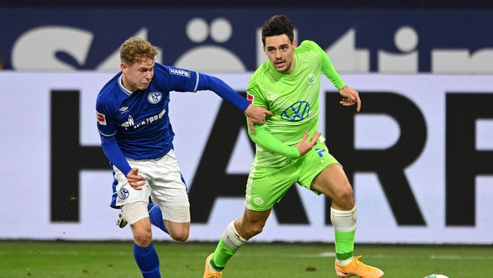 GELSENKIRCHEN, GERMANY - NOVEMBER 21: Kilian Ludewig of FC Schalke 04 battles for possession with Josip Brekalo of VfL Wolfsburg during the Bundesliga match between FC Schalke 04 and VfL Wolfsburg at Veltins-Arena on November 21, 2020 in Gelsenkirchen, Germany. Football Stadiums around Europe remain empty due to the Coronavirus Pandemic as Government social distancing laws prohibit fans inside venues resulting in fixtures being played behind closed doors. (Photo by Sascha Steinbach - Pool/Getty Images) GELSENKIRCHEN, GERMANY - NOVEMBER 21: Kilian Ludewig of FC Schalke 04 battles for possession with Josip Brekalo of VfL Wolfsburg during the Bundesliga match between FC Schalke 04 and VfL Wolfsburg at Veltins-Arena on November 21, 2020 in Gelsenkirchen, Germany. Football Stadiums around Europe remain empty due to the Coronavirus Pandemic as Government social distancing laws prohibit fans inside venues resulting in fixtures being played behind closed doors. (Photo by Sascha Steinbach - Pool/Getty Images)