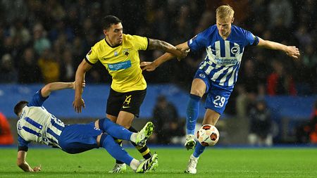 BRIGHTON, ENGLAND - SEPTEMBER 21: Ezequiel Ponce of AEK Athens battles with Billy Gilmour and Jan Paul van Hecke of Brighton during the Group B - UEFA Europa League 2023/24 match between Brighton & Hove Albion and AEK Athens FC at American Express Community Stadium on September 21, 2023 in Brighton, England. (Photo by Mike Hewitt/Getty Images)