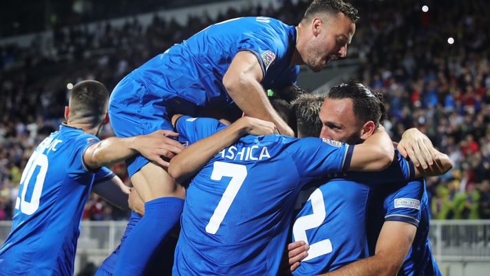 PRISTINA, KOSOVO - JUNE 09: Vedat Muriqi of Kosovo (R) celebrates with teammate's after scoring their team's third goal as Amir Rrahmani jumps on top during the UEFA Nations League League C Group 2 match between Kosovo and Northern Ireland at Fadil Vokrri Stadium on June 09, 2022 in Pristina, Kosovo. (Photo by Armando Babani/Getty Images) rrahmani kosovo