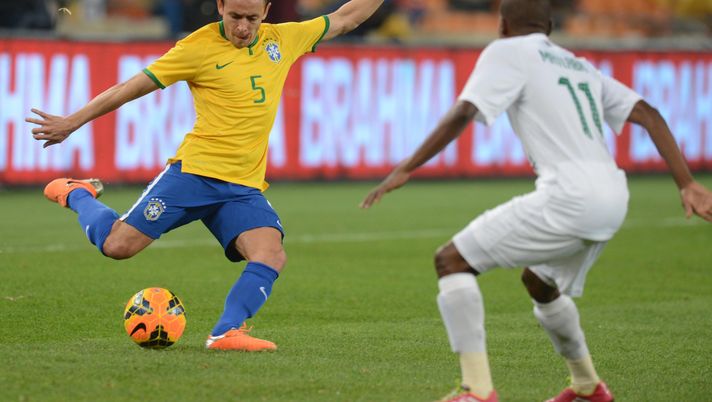 JOHANNESBURG, SOUTH AFRICA - MARCH 05: Rafinha of Brazil and Thabo Matlaba of South Africa during the International Friendly match between South Africa and Brazil at FNB Stadium on March 05, 2014 in Johannesburg, South Africa. (Photo by Lefty Shivambu/Gallo Images/Getty Images) 