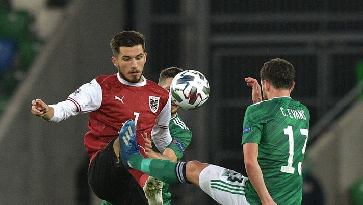 BELFAST, NORTHERN IRELAND - OCTOBER 11: Adrian Grbic of Austria battles for possession with Corry Evans of Northern Ireland during the UEFA Nations League group stage match between Northern Ireland and Austria at Windsor Park on October 11, 2020 in Belfast, Northern Ireland. The Irish Football Association are allowing limited number of spectators (600) to be in attendance as Covid-19 pandemic restrictions are eased. (Photo by Charles McQuillan/Getty Images) BELFAST, NORTHERN IRELAND - OCTOBER 11: Adrian Grbic of Austria battles for possession with Corry Evans of Northern Ireland during the UEFA Nations League group stage match between Northern Ireland and Austria at Windsor Park on October 11, 2020 in Belfast, Northern Ireland. The Irish Football Association are allowing limited number of spectators (600) to be in attendance as Covid-19 pandemic restrictions are eased. (Photo by Charles McQuillan/Getty Images)