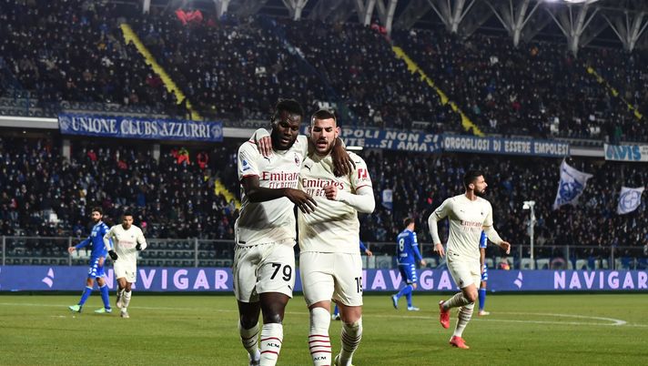EMPOLI, ITALY - DECEMBER 22: Franck Kessie of AC Milan celebrates with teammate Theo Hernandez after scoring the opening goal during the Serie A match between Empoli FC and AC Milan at Stadio Carlo Castellani on December 22, 2021 in Empoli, Italy. (Photo by Claudio Villa/AC Milan via Getty Images)