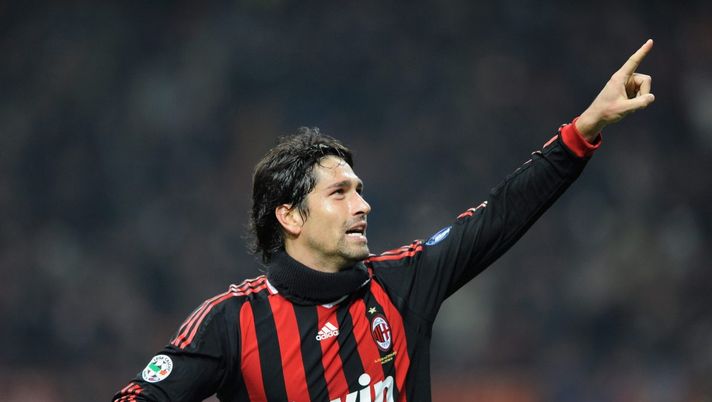 MILAN, ITALY - OCTOBER 31:  Marco Borriello of AC Milan celebrates after scoring the second goal during the Serie A match between AC Milan and Parma FC at the Stadio Giuseppe Meazza on October 31, 2009 in Milan, Italy.  (Photo by Claudio Villa/Getty Images) 