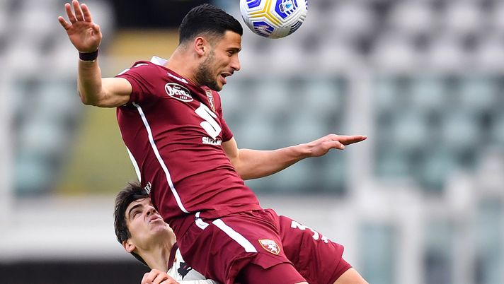 TURIN, ITALY - APRIL 18: Rolando Mandragora of Torino FC wins a header from Gonzalo Villar of A.S Roma during the Serie A match between Torino FC and AS Roma at Stadio Olimpico di Torino on April 18, 2021 in Turin, Italy. Sporting stadiums around Italy remain under strict restrictions due to the Coronavirus Pandemic as Government social distancing laws prohibit fans inside venues resulting in games being played behind closed doors. (Photo by Valerio Pennicino/Getty Images) TURIN, ITALY - APRIL 18: Rolando Mandragora of Torino FC wins a header from Gonzalo Villar of A.S Roma during the Serie A match between Torino FC and AS Roma at Stadio Olimpico di Torino on April 18, 2021 in Turin, Italy. Sporting stadiums around Italy remain under strict restrictions due to the Coronavirus Pandemic as Government social distancing laws prohibit fans inside venues resulting in games being played behind closed doors. (Photo by Valerio Pennicino/Getty Images)
