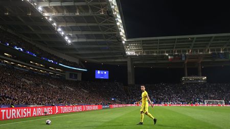 PORTO, PORTUGAL - MARCH 14: Hakan Calhanoglu of Inter Milan walks over to take a corner kick during the UEFA Champions League round of 16 leg two match between FC Porto and FC Internazionale at Estadio do Dragao on March 14, 2023 in Porto, Portugal. (Photo by Alex Pantling/Getty Images)