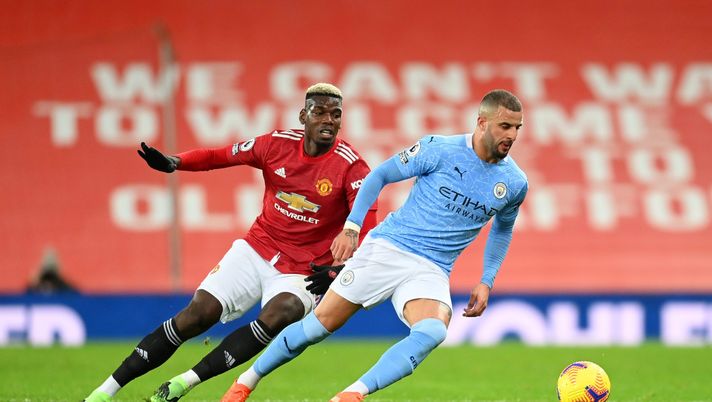 MANCHESTER, ENGLAND - DECEMBER 12: Kyle Walker of Manchester City is put under pressure by Paul Pogba of Manchester United during the Premier League match between Manchester United and Manchester City at Old Trafford on December 12, 2020 in Manchester, England. The match will be played without fans, behind closed doors as a Covid-19 precaution. (Photo by Michael Regan/Getty Images) MANCHESTER, ENGLAND - DECEMBER 12: Kyle Walker of Manchester City is put under pressure by Paul Pogba of Manchester United during the Premier League match between Manchester United and Manchester City at Old Trafford on December 12, 2020 in Manchester, England. The match will be played without fans, behind closed doors as a Covid-19 precaution. (Photo by Michael Regan/Getty Images)