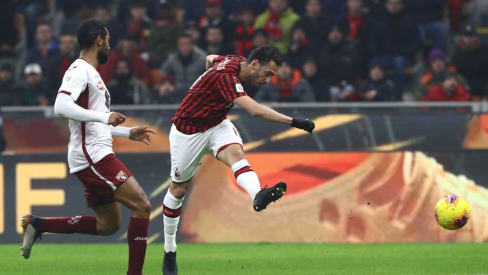 MILAN, ITALY - JANUARY 28:  Hakan Calhanoglu (R) of AC Milan scores his second goal during the Coppa Italia Quarter Final match between AC Milan and Torino at San Siro on January 28, 2020 in Milan, Italy.  (Photo by Marco Luzzani/Getty Images) 