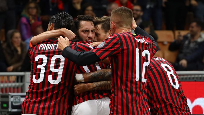 MILAN, ITALY - OCTOBER 20:  Hakan Calhanoglu (2nd L) of AC Milan celebrates with his team-mates after scoring the opening goal during the Serie A match between AC Milan and US Lecce at Stadio Giuseppe Meazza on October 20, 2019 in Milan, Italy.  (Photo by Marco Luzzani/Getty Images)  MILAN, ITALY - OCTOBER 20:  Hakan Calhanoglu (2nd L) of AC Milan celebrates with his team-mates after scoring the opening goal during the Serie A match between AC Milan and US Lecce at Stadio Giuseppe Meazza on October 20, 2019 in Milan, Italy.  (Photo by Marco Luzzani/Getty Images)