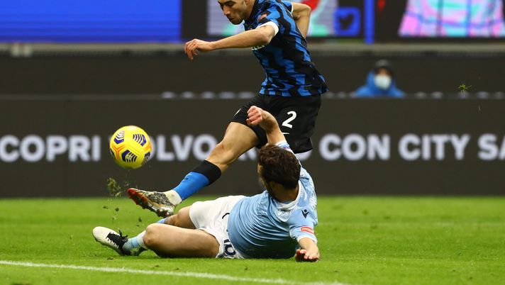 MILAN, ITALY - FEBRUARY 14: Achraf Hakimi of FC Internazionale has his shot blocked by Marco Parolo of S.S. Lazio during the Serie A match between FC Internazionale and SS Lazio at Stadio Giuseppe Meazza on February 14, 2021 in Milan, Italy. Sporting stadiums around Italy remain under strict restrictions due to the Coronavirus Pandemic as Government social distancing laws prohibit fans inside venues resulting in games being played behind closed doors. (Photo by Marco Luzzani/Getty Images) MILAN, ITALY - FEBRUARY 14: Achraf Hakimi of FC Internazionale has his shot blocked by Marco Parolo of S.S. Lazio during the Serie A match between FC Internazionale and SS Lazio at Stadio Giuseppe Meazza on February 14, 2021 in Milan, Italy. Sporting stadiums around Italy remain under strict restrictions due to the Coronavirus Pandemic as Government social distancing laws prohibit fans inside venues resulting in games being played behind closed doors. (Photo by Marco Luzzani/Getty Images)