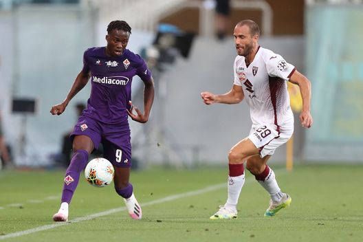 FLORENCE, ITALY - JULY 19: Christian Kouame of ACF Fiorentina battles for the ball with Lorenzo De Silvestri of Torino FC during the Serie A match between ACF Fiorentina and Torino FC at Stadio Artemio Franchi on July 19, 2020 in Florence, Italy. (Photo by Gabriele Maltinti/Getty Images) FLORENCE, ITALY - JULY 19: Christian Kouame of ACF Fiorentina battles for the ball with Lorenzo De Silvestri of Torino FC during the Serie A match between ACF Fiorentina and Torino FC at Stadio Artemio Franchi on July 19, 2020 in Florence, Italy. (Photo by Gabriele Maltinti/Getty Images)