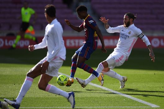 BARCELONA, SPAIN - OCTOBER 24: Ansu Fati of Barcelona scores his team's first goal during the La Liga Santander match between FC Barcelona and Real Madrid at Camp Nou on October 24, 2020 in Barcelona, Spain. Sporting stadiums around Spain remain under strict restrictions due to the Coronavirus Pandemic as Government social distancing laws prohibit fans inside venues resulting in games being played behind closed doors. (Photo by Alex Caparros/Getty Images) BARCELONA, SPAIN - OCTOBER 24: Ansu Fati of Barcelona scores his team's first goal during the La Liga Santander match between FC Barcelona and Real Madrid at Camp Nou on October 24, 2020 in Barcelona, Spain. Sporting stadiums around Spain remain under strict restrictions due to the Coronavirus Pandemic as Government social distancing laws prohibit fans inside venues resulting in games being played behind closed doors. (Photo by Alex Caparros/Getty Images)