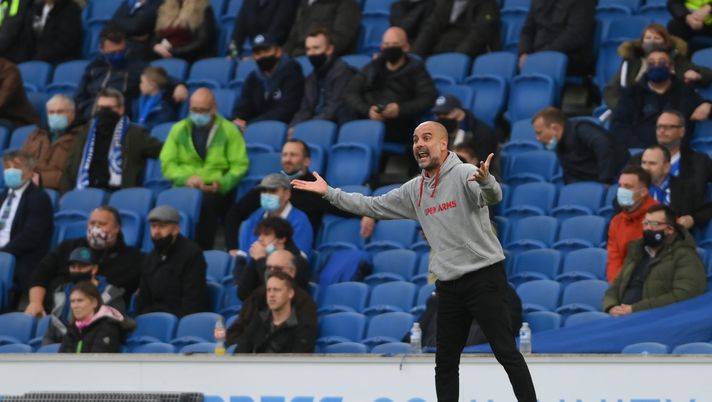 BRIGHTON, ENGLAND - MAY 18: Pep Guardiola, Manager of Manchester City reacts during the Premier League match between Brighton & Hove Albion and Manchester City at American Express Community Stadium on May 18, 2021 in Brighton, England. A limited number of fans will be allowed into Premier League stadiums as Coronavirus restrictions begin to ease in the UK following the COVID-19 pandemic. (Photo by Mike Hewitt/Getty Images) BRIGHTON, ENGLAND - MAY 18: Pep Guardiola, Manager of Manchester City reacts during the Premier League match between Brighton & Hove Albion and Manchester City at American Express Community Stadium on May 18, 2021 in Brighton, England. A limited number of fans will be allowed into Premier League stadiums as Coronavirus restrictions begin to ease in the UK following the COVID-19 pandemic. (Photo by Mike Hewitt/Getty Images)