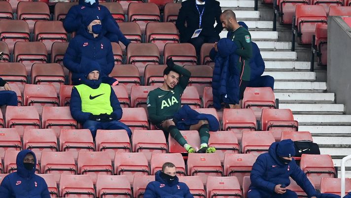 STOKE ON TRENT, ENGLAND - DECEMBER 23: Dele Alli of Tottenham Hotspur reacts as he takes his seat in the stands after being substituted off during the Carabao Cup Quarter Final match between Stoke City and Tottenham Hotspur at Bet365 Stadium on December 23, 2020 in Stoke on Trent, England. The match will be played without fans, behind closed doors as a Covid-19 precaution. (Photo by Michael Regan/Getty Images) STOKE ON TRENT, ENGLAND - DECEMBER 23: Dele Alli of Tottenham Hotspur reacts as he takes his seat in the stands after being substituted off during the Carabao Cup Quarter Final match between Stoke City and Tottenham Hotspur at Bet365 Stadium on December 23, 2020 in Stoke on Trent, England. The match will be played without fans, behind closed doors as a Covid-19 precaution. (Photo by Michael Regan/Getty Images)