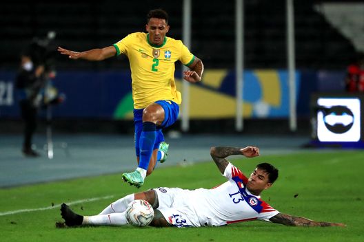 RIO DE JANEIRO, BRAZIL - JULY 02: Danilo da Silva of Brazil jumps over Erick Pulgar of Chile during a quarterfinal match between Brazil and Chile as part of Copa America Brazil 2021 at Estadio Olímpico Nilton Santos on July 02, 2021 in Rio de Janeiro, Brazil. (Photo by Buda Mendes/Getty Images) RIO DE JANEIRO, BRAZIL - JULY 02: Danilo da Silva of Brazil jumps over Erick Pulgar of Chile during a quarterfinal match between Brazil and Chile as part of Copa America Brazil 2021 at Estadio Olímpico Nilton Santos on July 02, 2021 in Rio de Janeiro, Brazil. (Photo by Buda Mendes/Getty Images)