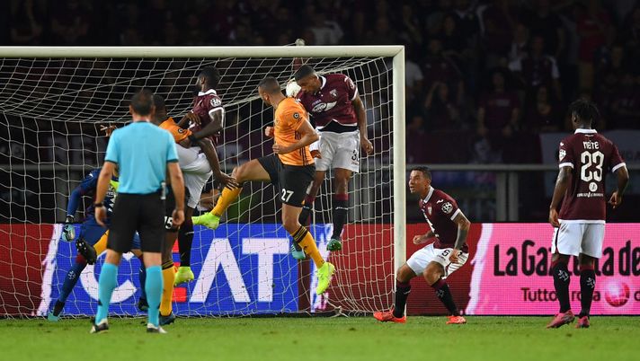 TURIN, ITALY - AUGUST 22:  Romain Saiss (C) of Wolverhampton Wanderers scores the opening goal during the UEFA Europa League Playoffs 1st Leg match between Torino and  Wolverhampton Wanderers at Stadio Olimpico on August 22, 2019 in Turin, Italy.  (Photo by Valerio Pennicino/Getty Images) 