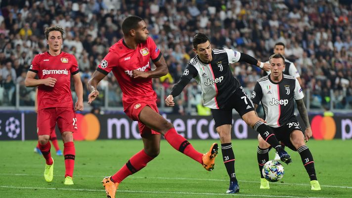 TURIN, ITALY - OCTOBER 01: (L - R) Jonathan Tah of Bayer Leverkusen competes for the ball with Cristiano Ronaldo of FC Juventus during the UEFA Champions League group D match between Juventus and Bayer Leverkusen at Juventus Arena on October 1, 2019 in Turin, Italy. (Photo by Pier Marco Tacca/Getty Images) TURIN, ITALY - OCTOBER 01: (L - R) Jonathan Tah of Bayer Leverkusen competes for the ball with Cristiano Ronaldo of FC Juventus during the UEFA Champions League group D match between Juventus and Bayer Leverkusen at Juventus Arena on October 1, 2019 in Turin, Italy. (Photo by Pier Marco Tacca/Getty Images)