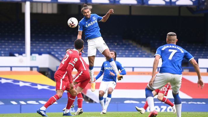LIVERPOOL, ENGLAND - OCTOBER 17: Dominic Calvert-Lewin of Everton scores his sides second goal during the Premier League match between Everton and Liverpool at Goodison Park on October 17, 2020 in Liverpool, England. Sporting stadiums around the UK remain under strict restrictions due to the Coronavirus Pandemic as Government social distancing laws prohibit fans inside venues resulting in games being played behind closed doors. (Photo by Laurence Griffiths/Getty Images) LIVERPOOL, ENGLAND - OCTOBER 17: Dominic Calvert-Lewin of Everton scores his sides second goal during the Premier League match between Everton and Liverpool at Goodison Park on October 17, 2020 in Liverpool, England. Sporting stadiums around the UK remain under strict restrictions due to the Coronavirus Pandemic as Government social distancing laws prohibit fans inside venues resulting in games being played behind closed doors. (Photo by Laurence Griffiths/Getty Images)