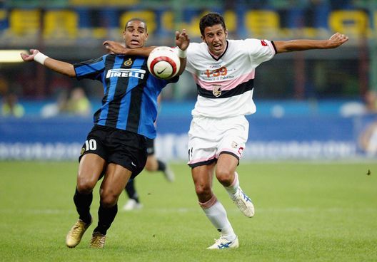 MILAN, ITALY - SEPTEMBER 18: Fabio Grosso of Palermo tussles with Adriano of Inter Milan during the Serie A match between Inter Milan and Palermo on 18 September, 2004 in Milan, Itlay. (Photo by New Press/Getty Images) Palermo