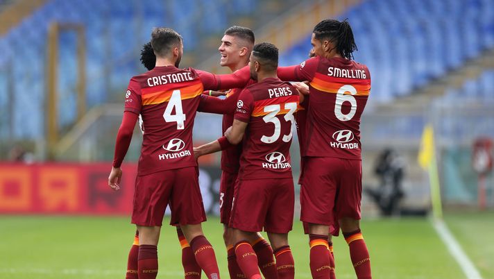 ROME, ITALY - MARCH 07: Gianluca Mancini of Roma celebrates with team mates (L - R) Bryan Cristante, Bruno Peres and Chris Smalling after scoring their side's first goal during the Serie A match between AS Roma and Genoa CFC at Stadio Olimpico on March 07, 2021 in Rome, Italy. Sporting stadiums around Italy remain under strict restrictions due to the Coronavirus Pandemic as Government social distancing laws prohibit fans inside venues resulting in games being played behind closed doors. (Photo by Paolo Bruno/Getty Images) ROME, ITALY - MARCH 07: Gianluca Mancini of Roma celebrates with team mates (L - R) Bryan Cristante, Bruno Peres and Chris Smalling after scoring their side's first goal during the Serie A match between AS Roma and Genoa CFC at Stadio Olimpico on March 07, 2021 in Rome, Italy. Sporting stadiums around Italy remain under strict restrictions due to the Coronavirus Pandemic as Government social distancing laws prohibit fans inside venues resulting in games being played behind closed doors. (Photo by Paolo Bruno/Getty Images)