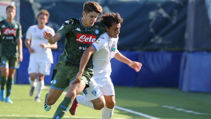 EMPOLI, ITALY - OCTOBER 07: Davide Merola of Empoli FC battles for the ball with Alesandro Zanoli of SSC Napol during the Serie A Primavera match between Empoli U19 and Napoli U19 on October 7, 2019 in Empoli, Italy.  (Photo by Gabriele Maltinti/Getty Images) 