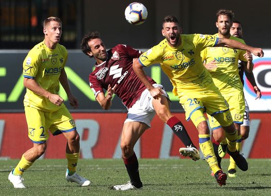 VERONA, ITALY - SEPTEMBER 30: Filip Djordjevic (R) of Chievo Verona clashes with Emiliano Moretti (C) of Torino FC during the Serie A match between Chievo Verona and Torino FC at Stadio Marc'Antonio Bentegodi on September 30, 2018 in Verona, Italy. (Photo by Marco Luzzani/Getty Images) VERONA, ITALY - SEPTEMBER 30: Filip Djordjevic (R) of Chievo Verona clashes with Emiliano Moretti (C) of Torino FC during the Serie A match between Chievo Verona and Torino FC at Stadio Marc'Antonio Bentegodi on September 30, 2018 in Verona, Italy. (Photo by Marco Luzzani/Getty Images)