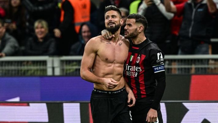 AC Milan's French forward Olivier Giroud (C) celebrates with AC Milan's French defender Theo Hernandez after scoring his side's second goal during the Italian Serie A football match between AC Milan and Spezia on November 5, 2022 at the San Siro stadium in Milan. (Photo by MIGUEL MEDINA / AFP) (Photo by MIGUEL MEDINA/AFP via Getty Images) Voti fantacalcio: Giroud come Theo, bene Tonali! Leao più di Origi, male Nzola - immagine 1