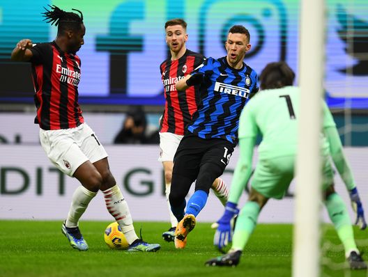 MILAN, ITALY - JANUARY 26: Ivan Perisic of FC Internazionale competes for the ball with Soualiho Meite of AC Milan during the Coppa Italia match between FC Internazionale and AC Milan at Stadio Giuseppe Meazza on January 26, 2021 in Milan, Italy. Sporting stadiums around Italy remain under strict restrictions due to the Coronavirus Pandemic as Government social distancing laws prohibit fans inside venues resulting in games being played behind closed doors. (Photo by Claudio Villa - Inter/Inter via Getty Images) MILAN, ITALY - JANUARY 26: Ivan Perisic of FC Internazionale competes for the ball with Soualiho Meite of AC Milan during the Coppa Italia match between FC Internazionale and AC Milan at Stadio Giuseppe Meazza on January 26, 2021 in Milan, Italy. Sporting stadiums around Italy remain under strict restrictions due to the Coronavirus Pandemic as Government social distancing laws prohibit fans inside venues resulting in games being played behind closed doors. (Photo by Claudio Villa - Inter/Inter via Getty Images)