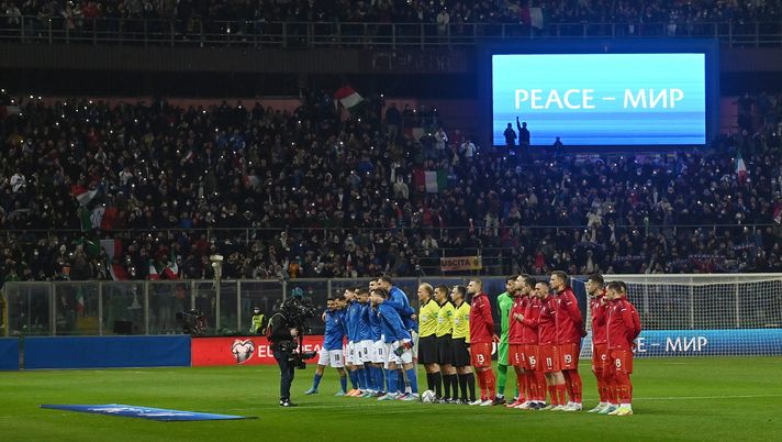 PALERMO, ITALY - MARCH 24: A general view inside the stadium as the players line up in front of banners to indicate peace and sympathy with Ukraine prior to the 2022 FIFA World Cup Qualifier knockout round play-off match between Italy and North Macedonia at Stadio Renzo Barbera on March 24, 2022 in Palermo, Italy. (Photo by Tullio M. Puglia/Getty Images) FIFA+