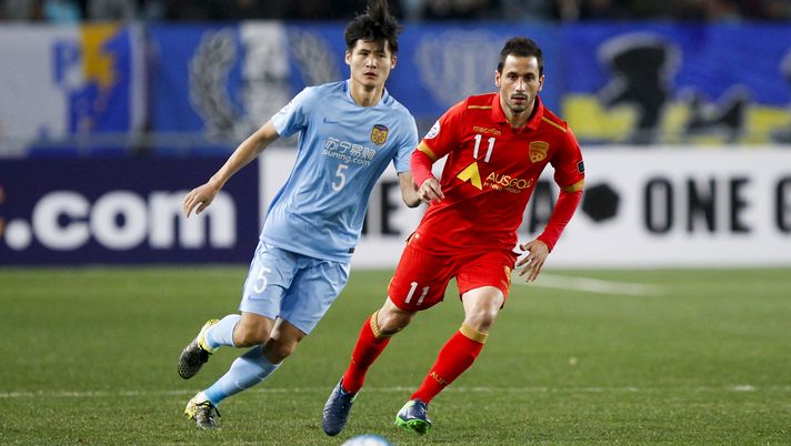 NANJING, CHINA - MARCH 01: Zhou Yun #5 of Jiangsu Suning and Marcelo Carrusca #11 of Adelaide United follow the ball during the AFC Champions League 2017 Group H match between Jiangsu Suning and Adelaide United at Nanjing Olympic Sports Centre on March 1, 2017 in Nanjing, Jiangsu Province of China. (Photo by Visual China/Getty Images) NANJING, CHINA - MARCH 01: Zhou Yun #5 of Jiangsu Suning and Marcelo Carrusca #11 of Adelaide United follow the ball during the AFC Champions League 2017 Group H match between Jiangsu Suning and Adelaide United at Nanjing Olympic Sports Centre on March 1, 2017 in Nanjing, Jiangsu Province of China. (Photo by Visual China/Getty Images)