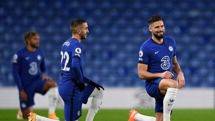 LONDON, ENGLAND - DECEMBER 05: Hakim Ziyech (C) and Olivier Giroud (R) of Chelsea takes a knee in support of the Black Lives Matter movement during the Premier League match between Chelsea and Leeds United at Stamford Bridge on December 05, 2020 in London, England. A limited number of fans are welcomed back to stadiums to watch elite football across England. This was following easing of restrictions on spectators in tiers one and two areas only. (Photo by Daniel Leal-Olivas - Pool/Getty Images) LONDON, ENGLAND - DECEMBER 05: Hakim Ziyech (C) and Olivier Giroud (R) of Chelsea takes a knee in support of the Black Lives Matter movement during the Premier League match between Chelsea and Leeds United at Stamford Bridge on December 05, 2020 in London, England. A limited number of fans are welcomed back to stadiums to watch elite football across England. This was following easing of restrictions on spectators in tiers one and two areas only. (Photo by Daniel Leal-Olivas - Pool/Getty Images)