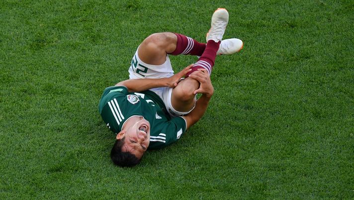 YEKATERINBURG, RUSSIA - JUNE 27:  Hirving Lozano of Mexico lies on the pitch injured during the 2018 FIFA World Cup Russia group F match between Mexico and Sweden at Ekaterinburg Arena on June 27, 2018 in Yekaterinburg, Russia.  (Photo by Dan Mullan/Getty Images) 