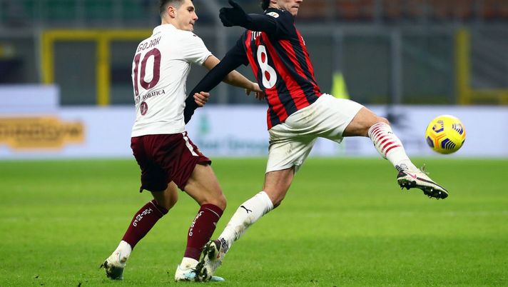 MILAN, ITALY - JANUARY 12: Sandro Tonali of A.C. Milan is challenged by Amer Gojak of Torino F.C. during the Coppa Italia match between AC Milan and Torino FC at Stadio Giuseppe Meazza on January 12, 2021 in Milan, Italy. Sporting stadiums around Italy remain under strict restrictions due to the Coronavirus Pandemic as Government social distancing laws prohibit fans inside venues resulting in games being played behind closed doors. (Photo by Marco Luzzani/Getty Images) MILAN, ITALY - JANUARY 12: Sandro Tonali of A.C. Milan is challenged by Amer Gojak of Torino F.C. during the Coppa Italia match between AC Milan and Torino FC at Stadio Giuseppe Meazza on January 12, 2021 in Milan, Italy. Sporting stadiums around Italy remain under strict restrictions due to the Coronavirus Pandemic as Government social distancing laws prohibit fans inside venues resulting in games being played behind closed doors. (Photo by Marco Luzzani/Getty Images)