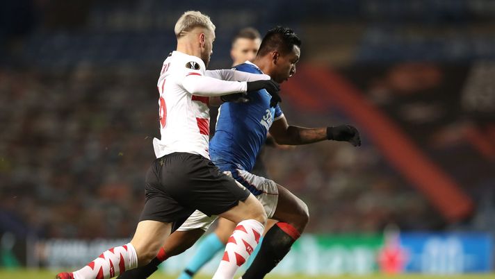 GLASGOW, SCOTLAND - DECEMBER 03: Alfredo Morelos of Rangers is challenged by Nicolas Raskin of Standard Liege during the UEFA Europa League Group D stage match between Rangers and Standard Liege at Ibrox Stadium on December 03, 2020 in Glasgow, Scotland. Sporting stadiums around the UK remain under strict restrictions due to the Coronavirus Pandemic as Government social distancing laws prohibit fans inside venues resulting in games being played behind closed doors. (Photo by Ian MacNicol/Getty Images) GLASGOW, SCOTLAND - DECEMBER 03: Alfredo Morelos of Rangers is challenged by Nicolas Raskin of Standard Liege during the UEFA Europa League Group D stage match between Rangers and Standard Liege at Ibrox Stadium on December 03, 2020 in Glasgow, Scotland. Sporting stadiums around the UK remain under strict restrictions due to the Coronavirus Pandemic as Government social distancing laws prohibit fans inside venues resulting in games being played behind closed doors. (Photo by Ian MacNicol/Getty Images)