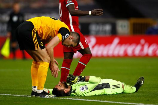 WOLVERHAMPTON, ENGLAND - MARCH 15: Rui Patricio of Wolverhampton Wanderers looks to be injured as he is checked by team mate Conor Coady (L) during the Premier League match between Wolverhampton Wanderers and Liverpool at Molineux on March 15, 2021 in Wolverhampton, England. Sporting stadiums around the UK remain under strict restrictions due to the Coronavirus Pandemic as Government social distancing laws prohibit fans inside venues resulting in games being played behind closed doors. (Photo by Jason Cairnduff - Pool/Getty Images) WOLVERHAMPTON, ENGLAND - MARCH 15: Rui Patricio of Wolverhampton Wanderers looks to be injured as he is checked by team mate Conor Coady (L) during the Premier League match between Wolverhampton Wanderers and Liverpool at Molineux on March 15, 2021 in Wolverhampton, England. Sporting stadiums around the UK remain under strict restrictions due to the Coronavirus Pandemic as Government social distancing laws prohibit fans inside venues resulting in games being played behind closed doors. (Photo by Jason Cairnduff - Pool/Getty Images)