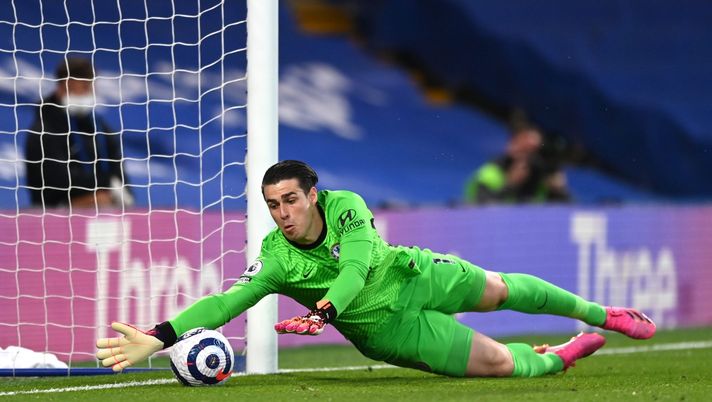 LONDON, ENGLAND - MAY 12: Kepa Arrizabalaga of Chelsea makes a save prior to Emile Smith Rowe of Arsenal (not pictured) scoring their sides first goal during the Premier League match between Chelsea and Arsenal at Stamford Bridge on May 12, 2021 in London, England. Sporting stadiums around the UK remain under strict restrictions due to the Coronavirus Pandemic as Government social distancing laws prohibit fans inside venues resulting in games being played behind closed doors. (Photo by Shaun Botterill/Getty Images) kepa