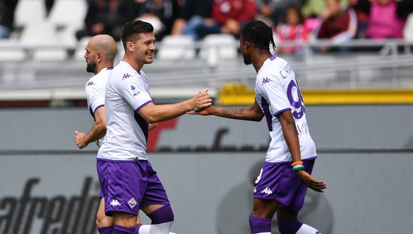 TURIN, ITALY - MAY 21: Luka Jovic of ACF Fiorentina celebrates with teammate Cristian Kouame after scoring the team's first goal during the Serie A match between Torino FC and ACF Fiorentina at Stadio Olimpico di Torino on May 21, 2023 in Turin, Italy. (Photo by Valerio Pennicino/Getty Images) jovic