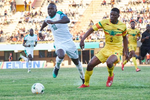 DAKAR, SENEGAL - MARCH 26: Sadio Mane of Senegal fights for the ball with Dibassi Bakaye of Mali during a friendly match between Senegal and Mali after both teams qualified for the 2019 CAN held in Egypt, on March 26, 2019 in Dakar, Senegal. (Photo by Xaume Olleros/Getty Images) DAKAR, SENEGAL - MARCH 26: Sadio Mane of Senegal fights for the ball with Dibassi Bakaye of Mali during a friendly match between Senegal and Mali after both teams qualified for the 2019 CAN held in Egypt, on March 26, 2019 in Dakar, Senegal. (Photo by Xaume Olleros/Getty Images)