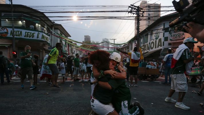 SAO PAULO, BRAZIL - JANUARY 30: Fans of Palmeiras near Palmeiras clubhouse and stadium celebrate after Palmeiras wins the match between Palmeiras and Santos as part of Copa CONMEBOL Libertadores 2020 Final on January 30, 2021 in Sao Paulo, Brazil. The match takes place at Maracana Stadium in Rio de Janeiro. (Photo by Miguel Schincariol/Getty Images) SAO PAULO, BRAZIL - JANUARY 30: Fans of Palmeiras near Palmeiras clubhouse and stadium celebrate after Palmeiras wins the match between Palmeiras and Santos as part of Copa CONMEBOL Libertadores 2020 Final on January 30, 2021 in Sao Paulo, Brazil. The match takes place at Maracana Stadium in Rio de Janeiro. (Photo by Miguel Schincariol/Getty Images)