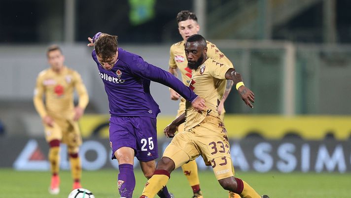 FLORENCE, ITALY - OCTOBER 25: Federico Chiesa of ACF Fiorentina battles for the ball with Nikolas N'Koulou of Torino Fc during the Serie A match between ACF Fiorentina and Torino FC at Stadio Artemio Franchi on October 25, 2017 in Florence, Italy.  (Photo by Gabriele Maltinti/Getty Images) 