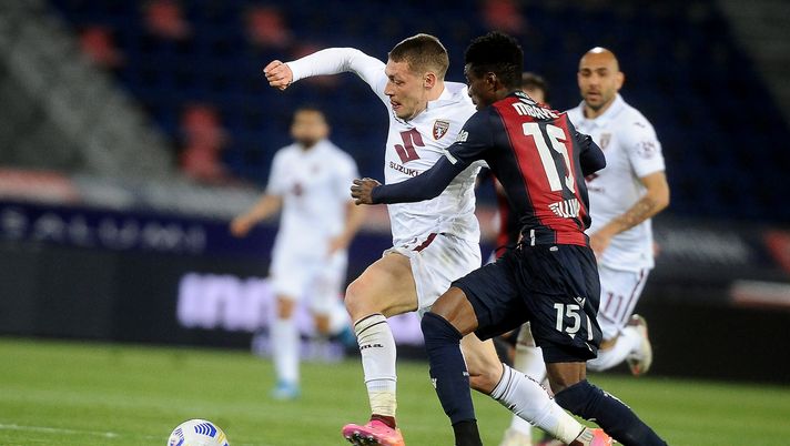 BOLOGNA, ITALY - APRIL 21: Andre Belotti of Torino FC ( L 9 competes the balll with Ibahima Mbye ( R ) during the Serie A match between Bologna FC  and Torino FC at Stadio Renato Dall'Ara on April 21, 2021 in Bologna, Italy. (Photo by Mario Carlini / Iguana Press/Getty Images) 