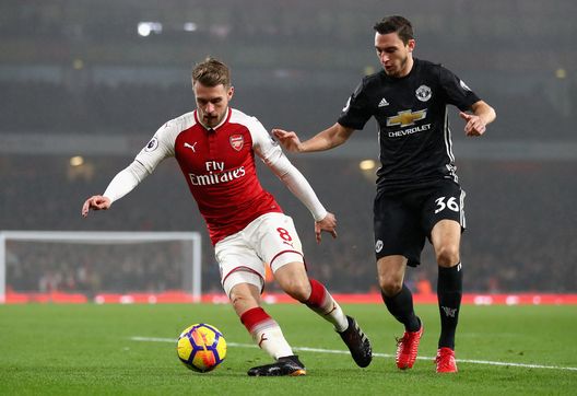  LONDON, ENGLAND - DECEMBER 02: Aaron Ramsey of Arsenal is challenged by Matteo Darmian of Manchester United during the Premier League match between Arsenal and Manchester United at Emirates Stadium on December 2, 2017 in London, England. (Photo by Julian Finney/Getty Images) 
